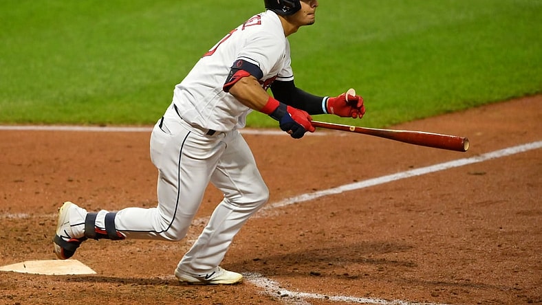 Aug 26, 2021; Cleveland, Ohio, USA; Cleveland Indians second baseman Andres Gimenez (0) hits an RBI double against the Texas Rangers in the fourth inning at Progressive Field. Mandatory Credit: David Richard-USA TODAY Sports