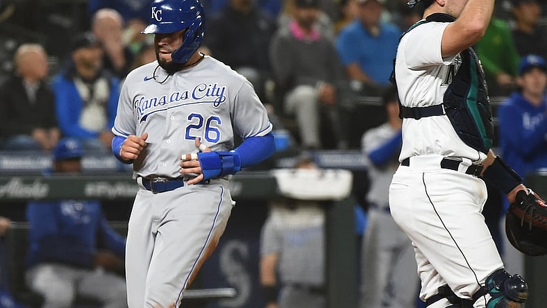 Aug 26, 2021; Seattle, Washington, USA; Kansas City Royals third baseman Emmanuel Rivera (26) scores from second base against the Seattle Mariners in the seventh inning at T-Mobile Park. Mandatory Credit: James Snook-USA TODAY Sports