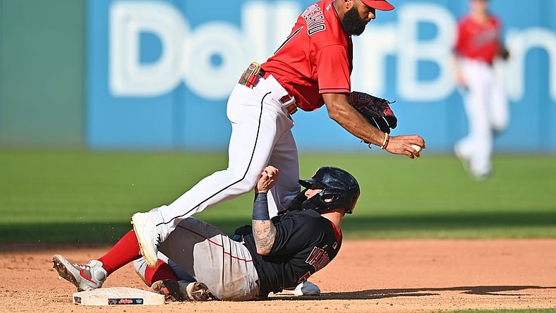 Aug 28, 2021; Cleveland, Ohio, USA; Cleveland Indians shortstop Amed Rosario (1) forces out Boston Red Sox catcher Christian Vazquez (7) during the fifth inning at Progressive Field. Mandatory Credit: Ken Blaze-USA TODAY Sports