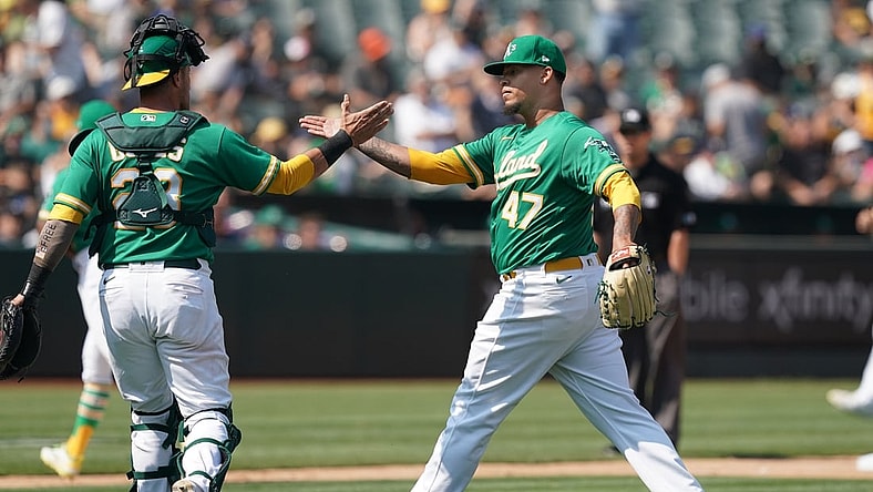 Aug 28, 2021; Oakland, California, USA; Oakland Athletics starting pitcher Frankie Montas (47) celebrates with catcher Yan Gomes (23) during the seventh inning against the New York Yankees at RingCentral Coliseum. Mandatory Credit: Darren Yamashita-USA TODAY Sports