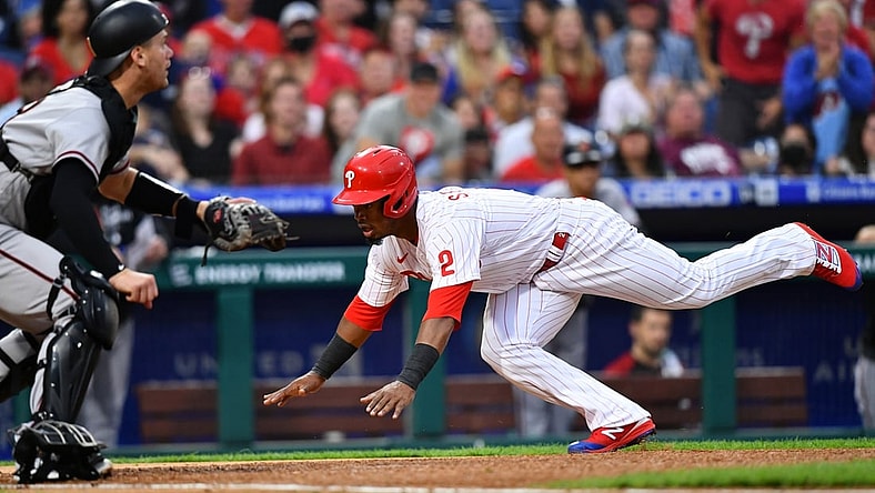Aug 28, 2021; Philadelphia, Pennsylvania, USA; Philadelphia Phillies infielder Jean Segura (2) dives home to score in the first inning against the Arizona Diamondbacks at Citizens Bank Park. Mandatory Credit: Kyle Ross-USA TODAY Sports