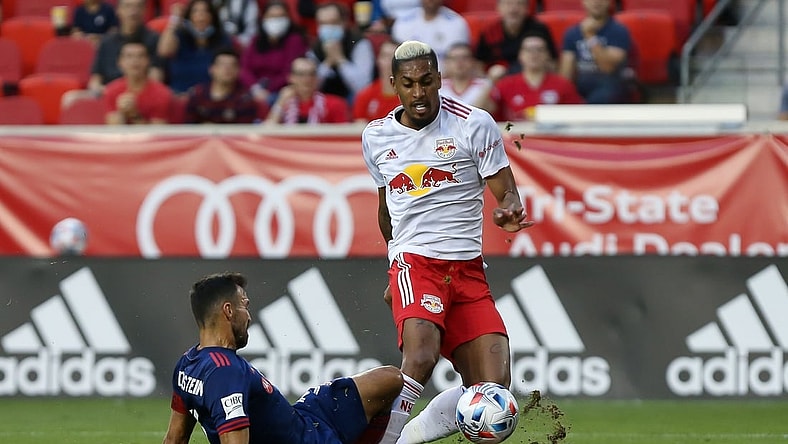 Aug 28, 2021; Harrison, New Jersey, USA;  Chicago Fire defender Jonathan Bornstein (3) slide tackles the ball away from New York Red Bulls forward Fabio (9) during the first half at Red Bull Arena. Mandatory Credit: Tom Horak-USA TODAY Sports