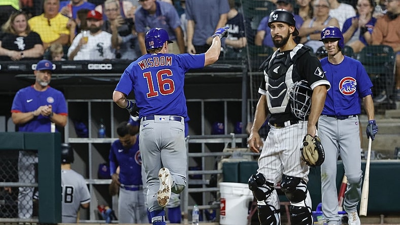 Aug 28, 2021; Chicago, Illinois, USA; Chicago Cubs third baseman Patrick Wisdom (16) celebrates as he crosses home plate after hitting a solo home run against the Chicago White Sox during the fifth inning at Guaranteed Rate Field. Mandatory Credit: Kamil Krzaczynski-USA TODAY Sports