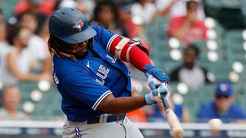 Aug 29, 2021; Detroit, Michigan, USA;  Toronto Blue Jays designated hitter Vladimir Guerrero Jr. (27) hits a single against the Detroit Tigers at Comerica Park. Mandatory Credit: Rick Osentoski-USA TODAY Sports