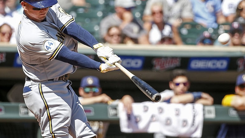 Aug 29, 2021; Minneapolis, Minnesota, USA; Milwaukee Brewers shortstop Luis Urias (2) hits a solo home run against the Minnesota Twins in the second inning at Target Field. Mandatory Credit: Bruce Kluckhohn-USA TODAY Sports