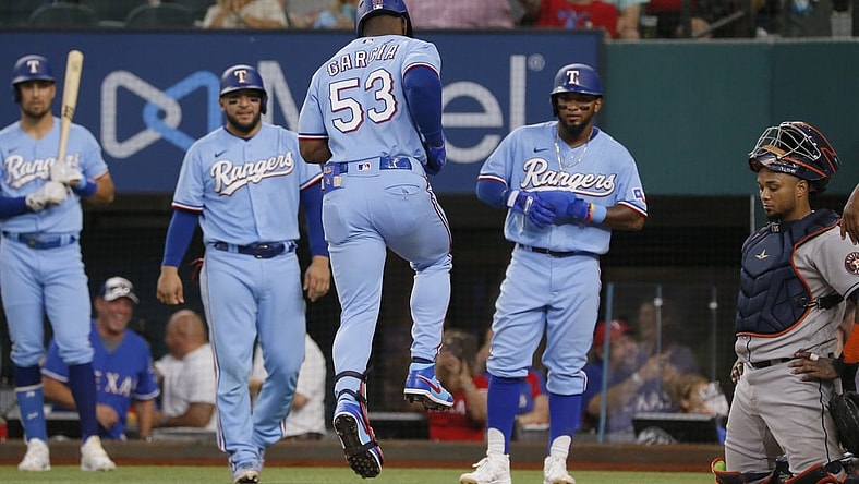 Aug 29, 2021; Arlington, Texas, USA; Texas Rangers right fielder Adolis Garcia (53) reaches home after hitting a grand slam against the Houston Astros during the fifth inning at Globe Life Field. Mandatory Credit: Raymond Carlin III-USA TODAY Sports