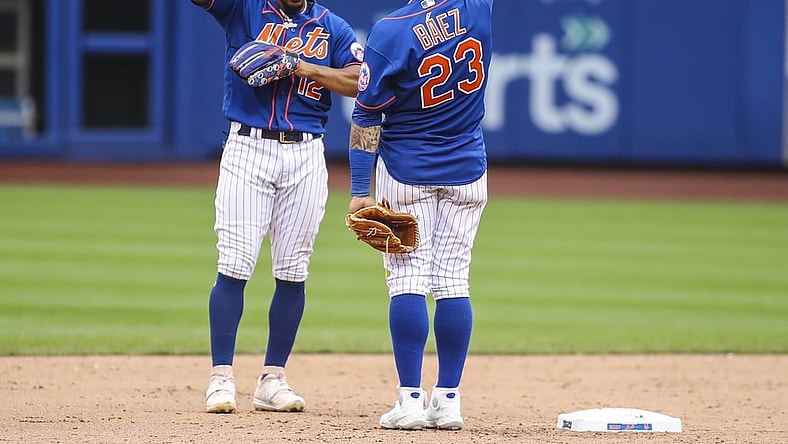 Aug 29, 2021; New York City, New York, USA; New York Mets shortstop Francisco Lindor (12) and second baseman Javier Baez (23) celebrate after defeating the Washington Nationals 9-4 at Citi Field. Mandatory Credit: Wendell Cruz-USA TODAY Sports