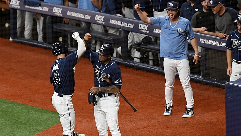 Aug 30, 2021; St. Petersburg, Florida, USA; Tampa Bay Rays second baseman Brandon Lowe (8) celebrates with shortstop Wander Franco (5) after hitting a solo home run in the first inning against the Boston Red Sox  at Tropicana Field. Mandatory Credit: Jonathan Dyer-USA TODAY Sports