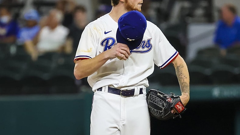 Aug 30, 2021; Arlington, Texas, USA;  Texas Rangers starting pitcher A.J. Alexy (62) throws reacts during the third inning against the Colorado Rockies at Globe Life Field. Mandatory Credit: Kevin Jairaj-USA TODAY Sports