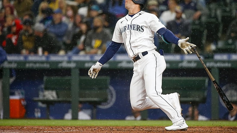 Aug 30, 2021; Seattle, Washington, USA; Seattle Mariners pinch hitter Dylan Moore (25) hits a two-run home against the Houston Astros during the sixth inning at T-Mobile Park. Mandatory Credit: Joe Nicholson-USA TODAY Sports