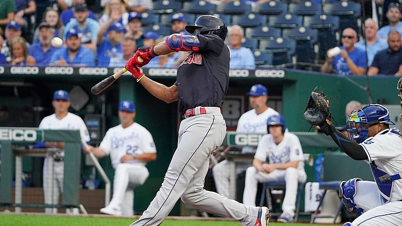 Aug 31, 2021; Kansas City, Missouri, USA; Cleveland Indians shortstop Amed Rosario (1) connects for a solo inside the park home run against the Kansas City Royals in the first inning at Kauffman Stadium. Mandatory Credit: Denny Medley-USA TODAY Sports