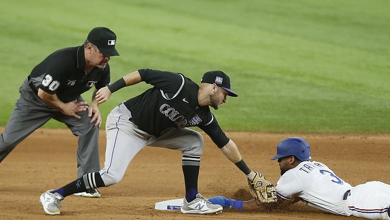 Aug 31, 2021; Arlington, Texas, USA; Texas Rangers center fielder Leody Taveras (3) steals second base against Colorado Rockies second baseman Garrett Hampson (1) in the sixth inning at Globe Life Field. Mandatory Credit: Tim Heitman-USA TODAY Sports