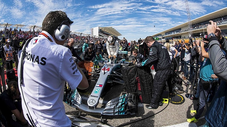 Oct 21, 2018; Austin, TX, USA; Mercedes driver Lewis Hamilton (44) of Great Britain exits his car before the start of the United States Grand Prix at Circuit of the Americas. Mandatory Credit: Jerome Miron-USA TODAY Sports