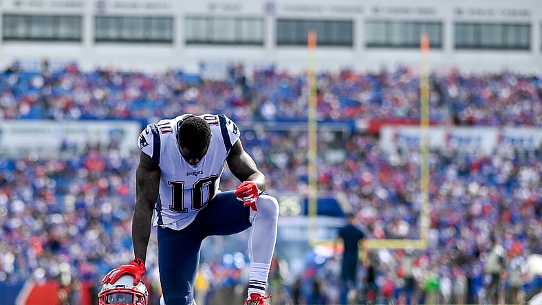 Sep 29, 2019; Orchard Park, NY, USA; New England Patriots wide receiver Josh Gordon (10) takes a knee in the end zone prior to the game between the Buffalo Bills and the New England Patriots at New Era Field. Mandatory Credit: Douglas DeFelice-USA TODAY Sports