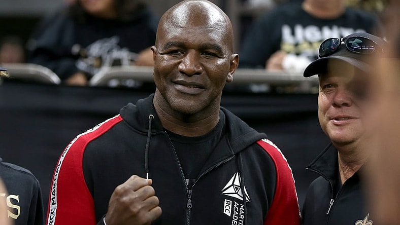 Nov 10, 2019; New Orleans, LA, USA; Former heavyweight boxing champion Evander Holyfield poses for pictures before a game between the New Orleans Saints and the Atlanta Falcons at the Mercedes-Benz Superdome. Mandatory Credit: Chuck Cook-USA TODAY Sports