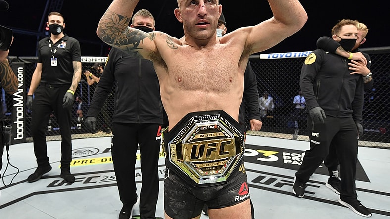 July 12, 2020; Abu Dhabi, UAE;  Alexander Volkanovski of Australia celebrates after his split-decision victory over Max Holloway in their UFC featherweight championship fight during the UFC 251 event at Flash Forum on UFC Fight Island on July 12, 2020 on Yas Island, Abu Dhabi, United Arab Emirates. Mandatory Credit: Jeff Bottari/Zuffa LLC via USA TODAY Sports