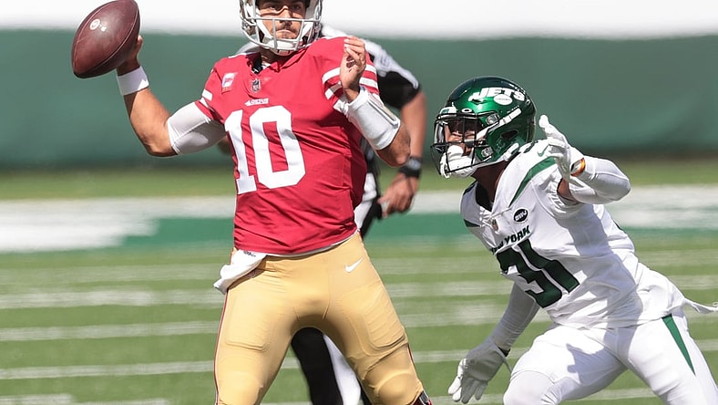 Sep 20, 2020; East Rutherford, New Jersey, USA; San Francisco 49ers quarterback Jimmy Garoppolo (10) throws a pass during the first quarter as New York Jets cornerback Blessuan Austin (31) defends at MetLife Stadium. Mandatory Credit: Vincent Carchietta-USA TODAY Sports