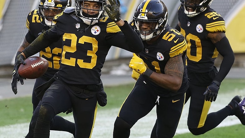 Dec 2, 2020; Pittsburgh, Pennsylvania, USA;  Pittsburgh Steelers cornerback Joe Haden (23) celebrates his fourteen yard interception return for a touchdown with teammates against the Baltimore Ravens during the first quarter at Heinz Field. Mandatory Credit: Charles LeClaire-USA TODAY Sports