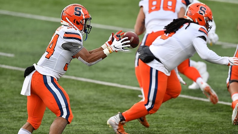 Dec 5, 2020; South Bend, Indiana, USA; Syracuse Orange running back Sean Tucker (34) takes a direct snap in the second quarter against the Notre Dame Fighting Irish at Notre Dame Stadium. Mandatory Credit: Matt Cashore-USA TODAY Sports