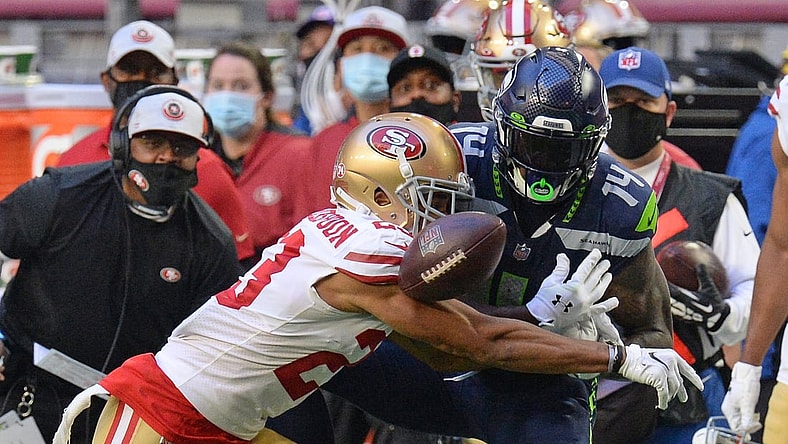 Jan 3, 2021; Glendale, Arizona, USA; San Francisco 49ers cornerback Ahkello Witherspoon (23) breaks up a pass intended for Seattle Seahawks wide receiver DK Metcalf (14) during the second half at State Farm Stadium. Mandatory Credit: Joe Camporeale-USA TODAY Sports