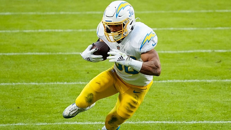 Jan 3, 2021; Kansas City, Missouri, USA; Los Angeles Chargers running back Austin Ekeler (30) runs the ball against the Kansas City Chiefs during the first half at Arrowhead Stadium. Mandatory Credit: Jay Biggerstaff-USA TODAY Sports