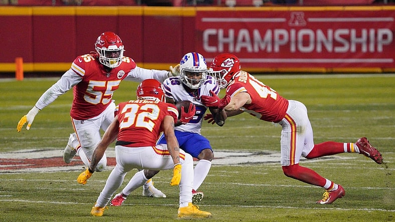 Jan 24, 2021; Kansas City, MO, USA; Buffalo Bills wide receiver Isaiah McKenzie (19) runs between Kansas City Chiefs strong safety Tyrann Mathieu (32), defensive end Frank Clark (55) and free safety Daniel Sorensen (49) during the fourth quarter in the AFC Championship Game at Arrowhead Stadium. Mandatory Credit: Denny Medley-USA TODAY Sports