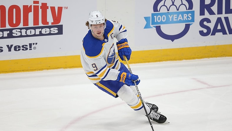 Mar 7, 2021; Uniondale, New York, USA; Buffalo Sabres center Jack Eichel (9) controls the puck against the New York Islanders during the third period at Nassau Veterans Memorial Coliseum. Mandatory Credit: Brad Penner-USA TODAY Sports
