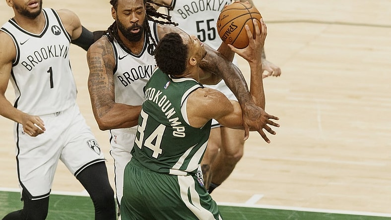 May 2, 2021; Milwaukee, Wisconsin, USA; Brooklyn Nets center DeAndre Jordan (6) fouls Milwaukee Bucks forward Giannis Antetokounmpo (34) during the second quarter at Fiserv Forum. Mandatory Credit: Jeff Hanisch-USA TODAY Sports