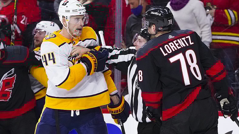 May 17, 2021; Raleigh, North Carolina, USA; Nashville Predators defenseman Erik Gudbranson (44) goes after Carolina Hurricanes left wing Steven Lorentz (78) during the second period in game one of the first round of the 2021 Stanley Cup Playoffs at PNC Arena. Mandatory Credit: James Guillory-USA TODAY Sports