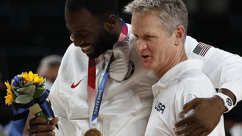 Aug 7, 2021; Saitama, Japan; United States forward Draymond Green (L) hugs assistant coach Steve Kerr (R) after the medal ceremony during the Tokyo 2020 Olympic Summer Games at Saitama Super Arena. Mandatory Credit: Geoff Burke-USA TODAY Sports
