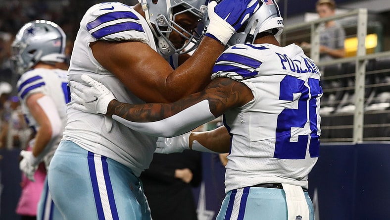 Aug 21, 2021; Arlington, Texas, USA; Dallas Cowboys running back Tony Pollard (20) celebrates a first quarter touchdown with tackle La'el Collins (71) against the Houston Texans at AT&T Stadium. Mandatory Credit: Matthew Emmons-USA TODAY Sports