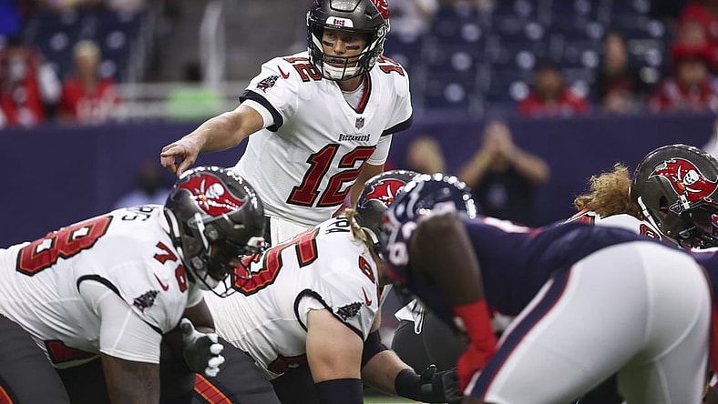 Aug 28, 2021; Houston, Texas, USA; Tampa Bay Buccaneers quarterback Tom Brady (12) calls a play at the line of scrimmage during the first quarter against the Houston Texans at NRG Stadium. Mandatory Credit: Troy Taormina-USA TODAY Sports