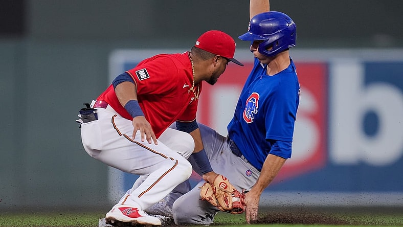 Aug 31, 2021; Minneapolis, Minnesota, USA; Chicago Cubs second baseman Matt Duffy (5) steals second base against the Minnesota Twins second baseman Luis Arraez (2) in the second inning at Target Field. Mandatory Credit: Brad Rempel-USA TODAY Sports
