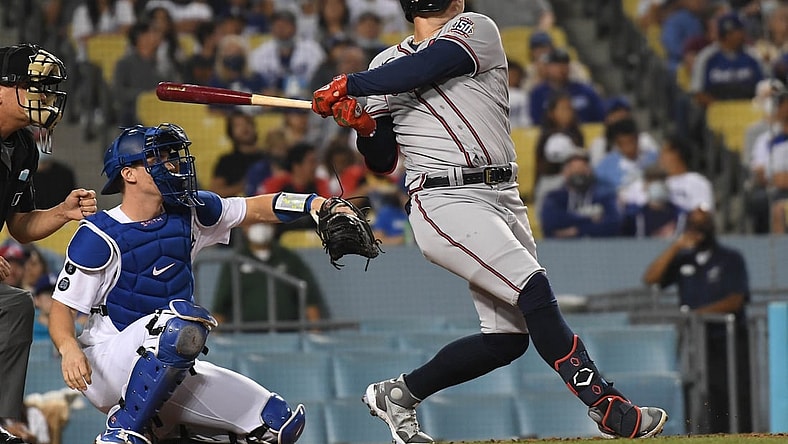 Aug 31, 2021; Los Angeles, California, USA; Atlanta Braves center fielder Joc Pederson (22) hits a solo home run against the Los Angeles Dodgers during the third inning at Dodger Stadium. Mandatory Credit: Richard Mackson-USA TODAY Sports