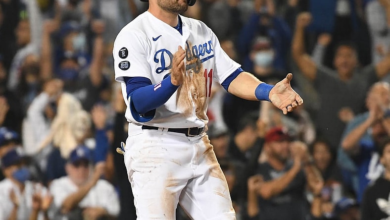 Aug 31, 2021; Los Angeles, California, USA; Los Angeles Dodgers left fielder AJ Pollock (11) reacts after scoring a run against the Atlanta Braves during the seventh inning at Dodger Stadium. Mandatory Credit: Richard Mackson-USA TODAY Sports