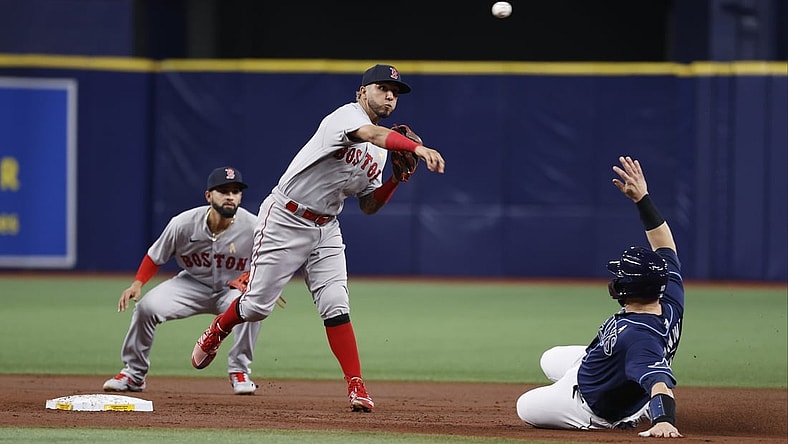 Sep 1, 2021; St. Petersburg, Florida, USA;  Boston Red Sox shortstop Jonathan Arauz (3) forces out Tampa Bay Rays catcher Mike Zunino (10) and throws the ball to first base for a double play during the second inning at Tropicana Field. Mandatory Credit: Kim Klement-USA TODAY Sports