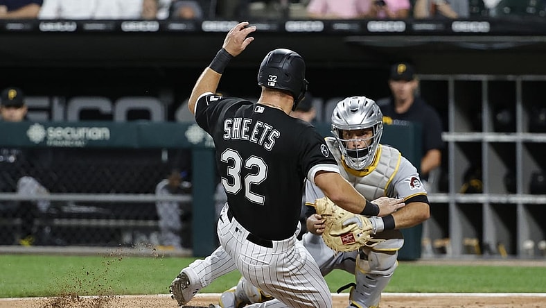 Sep 1, 2021; Chicago, Illinois, USA; Pittsburgh Pirates catcher Jacob Stallings (58) tags out Chicago White Sox first baseman Gavin Sheets (32) during the third inning at Guaranteed Rate Field. Mandatory Credit: Kamil Krzaczynski-USA TODAY Sports