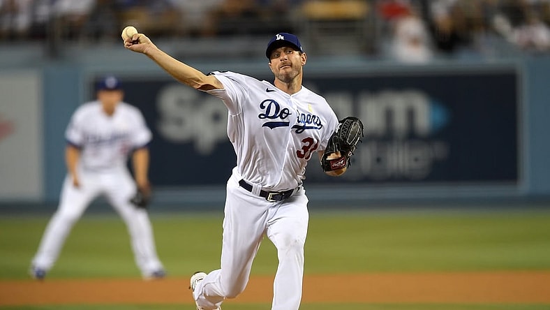 Sep 1, 2021; Los Angeles, California, USA;  Los Angeles Dodgers starting pitcher Max Scherzer (31) pitches in the third inning of the game against the Atlanta Braves at Dodger Stadium. Mandatory Credit: Jayne Kamin-Oncea-USA TODAY Sports