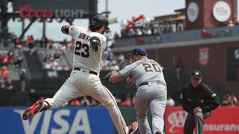 Sep 2, 2021; San Francisco, California, USA;  San Francisco Giants third baseman Kris Bryant (23) hits a single during the third inning against the Milwaukee Brewers at Oracle Park. Mandatory Credit: Sergio Estrada-USA TODAY Sports