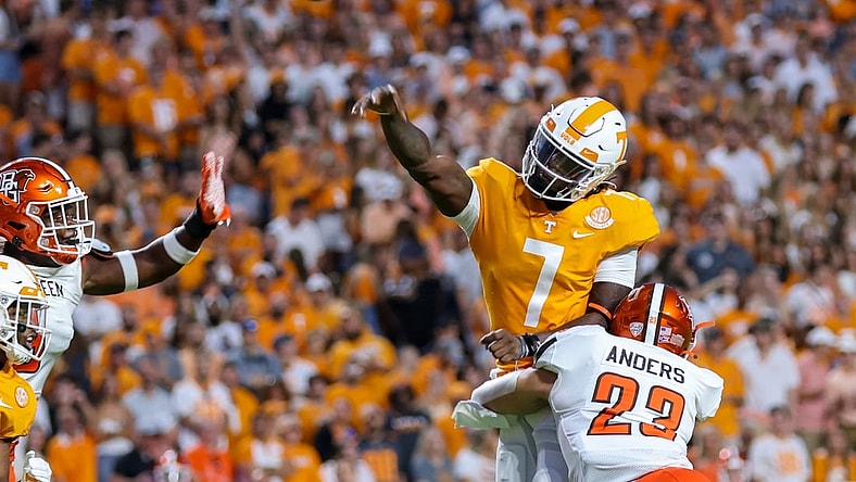 Sep 2, 2021; Knoxville, Tennessee, USA; Tennessee Volunteers quarterback Joe Milton III (7) throws the ball against Bowling Green Falcons linebacker Darren Anders (23) during the first quarter at Neyland Stadium. Mandatory Credit: Randy Sartin-USA TODAY Sports