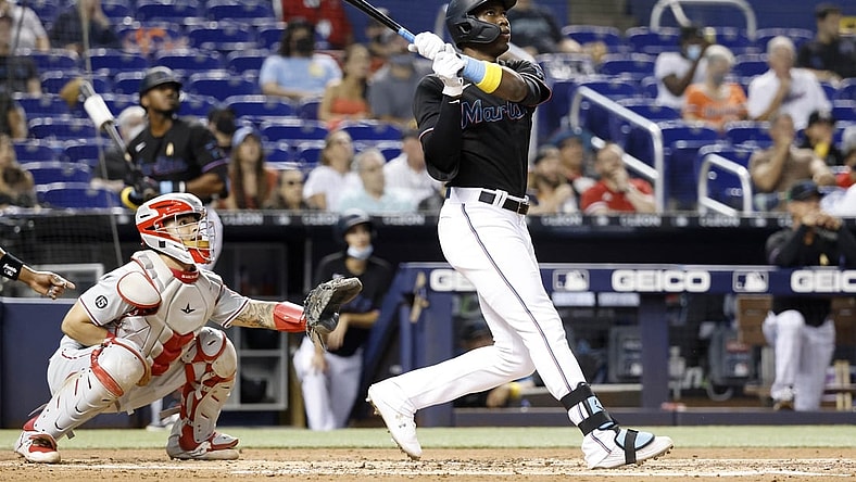 Sep 3, 2021; Miami, Florida, USA; Miami Marlins right fielder Jesus Sanchez (76) hits a three run home run against the Philadelphia Phillies during the first inning at loanDepot Park. Mandatory Credit: Rhona Wise-USA TODAY Sports
