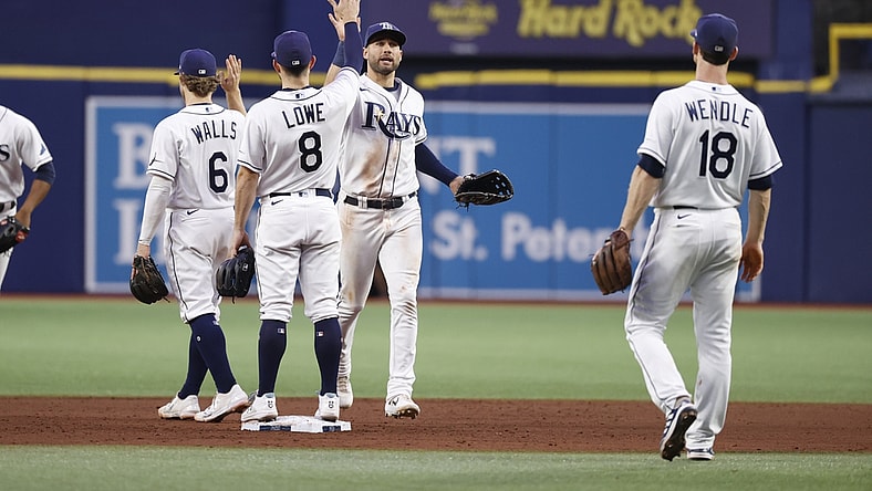 Sep 3, 2021; St. Petersburg, Florida, USA;  Tampa Bay Rays center fielder Kevin Kiermaier (39), second baseman Brandon Lowe (8) and teammates high five as they beat the Minnesota Twins at Tropicana Field. Mandatory Credit: Kim Klement-USA TODAY Sports
