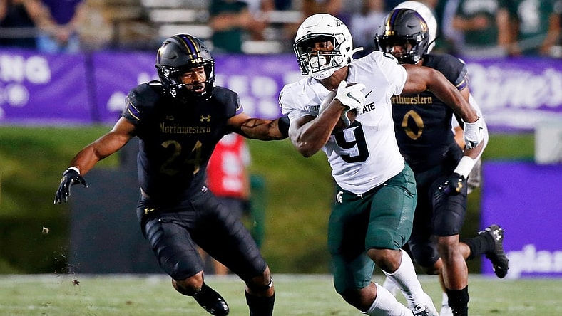 Sep 3, 2021; Evanston, Illinois, USA; Michigan State Spartans running back Kenneth Walker III (9) runs the ball against the Northwestern Wildcats during the second quarter at Ryan Field. Mandatory Credit: Jon Durr-USA TODAY Sports