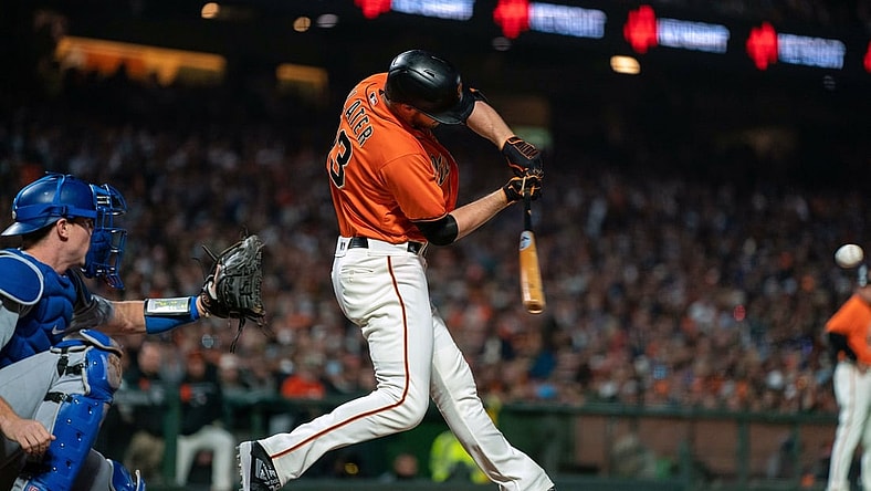 Sep 3, 2021; San Francisco, California, USA;  San Francisco Giants right fielder Austin Slater (13) hits a RBI single against the Los Angeles Dodgers during the third inning at Oracle Park. Mandatory Credit: Neville E. Guard-USA TODAY Sports