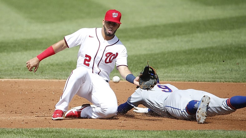 Sep 4, 2021; Washington, District of Columbia, USA; New York Mets center fielder Brandon Nimmo (9) steals second base ahead of a tag by Washington Nationals second baseman Luis Garcia (2) in the second inning at Nationals Park. Mandatory Credit: Amber Searls-USA TODAY Sports