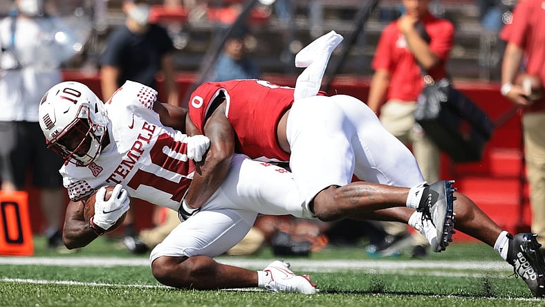 Sep 4, 2021; Piscataway, New Jersey, USA; Temple Owls wide receiver Jose Barbon (10) is tackled by Rutgers Scarlet Knights defensive back Christian Izien (0) during the second half at SHI Stadium. Mandatory Credit: Vincent Carchietta-USA TODAY Sports