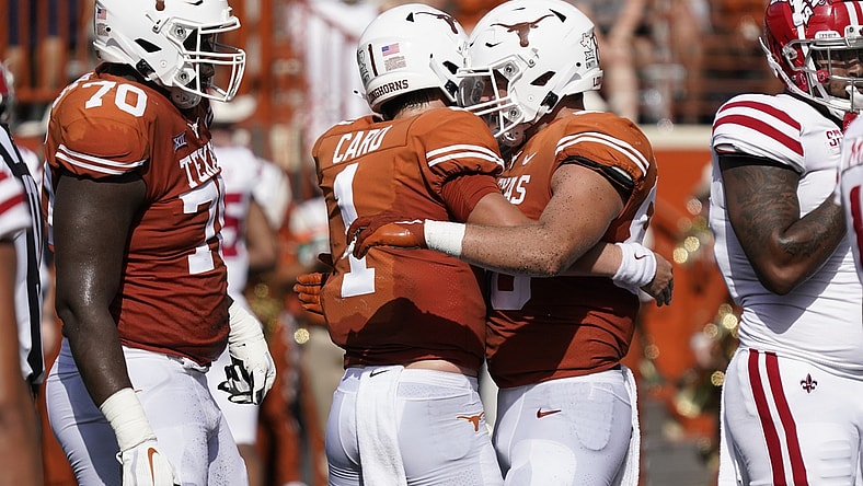 Sep 4, 2021; Austin, Texas, USA; Texas Longhorns tight end Cade Brewer (80) hugs quarterback Hudson Card (1) after catching a touchdown pass in the first half of the game against the Louisiana Ragin' Cajuns at Darrell K Royal-Texas Memorial Stadium. Mandatory Credit: Scott Wachter-USA TODAY Sports