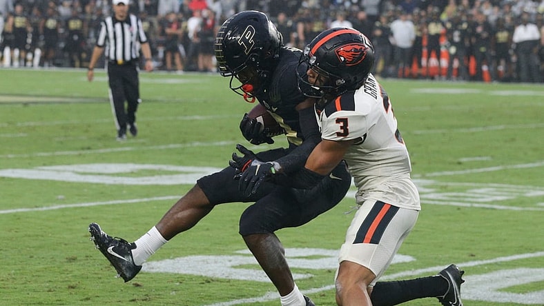 Purdue wide receiver David Bell (3) is tackled by Oregon State defensive back Jaydon Grant (3) during the first quarter of an NCAA college football game, Saturday, Sept. 4, 2021 at Ross-Ade Stadium in West Lafayette.

Cfb Purdue Vs Oregon State