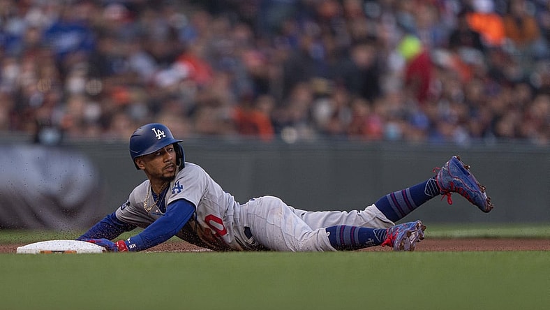 Sep 4, 2021; San Francisco, California, USA;  Los Angeles Dodgers right fielder Mookie Betts (50) slides during the first inning against the San Francisco Giants at Oracle Park. Mandatory Credit: Stan Szeto-USA TODAY Sports
