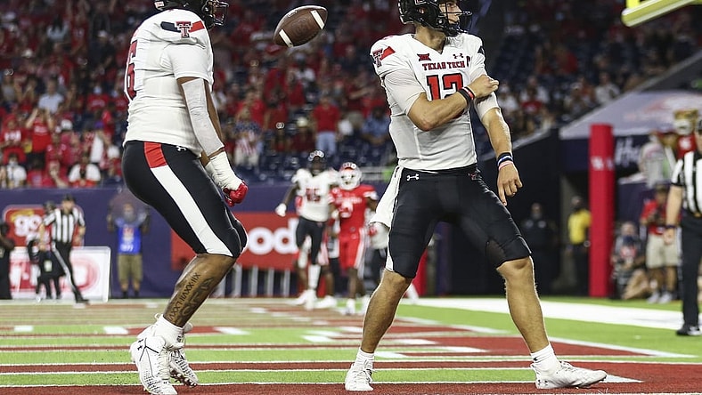 Sep 4, 2021; Houston, Texas, USA; Texas Tech Red Raiders quarterback Tyler Shough (12) reacts after rushing for a touchdown during the third quarter against the Houston Cougars at NRG Stadium. Mandatory Credit: Troy Taormina-USA TODAY Sports